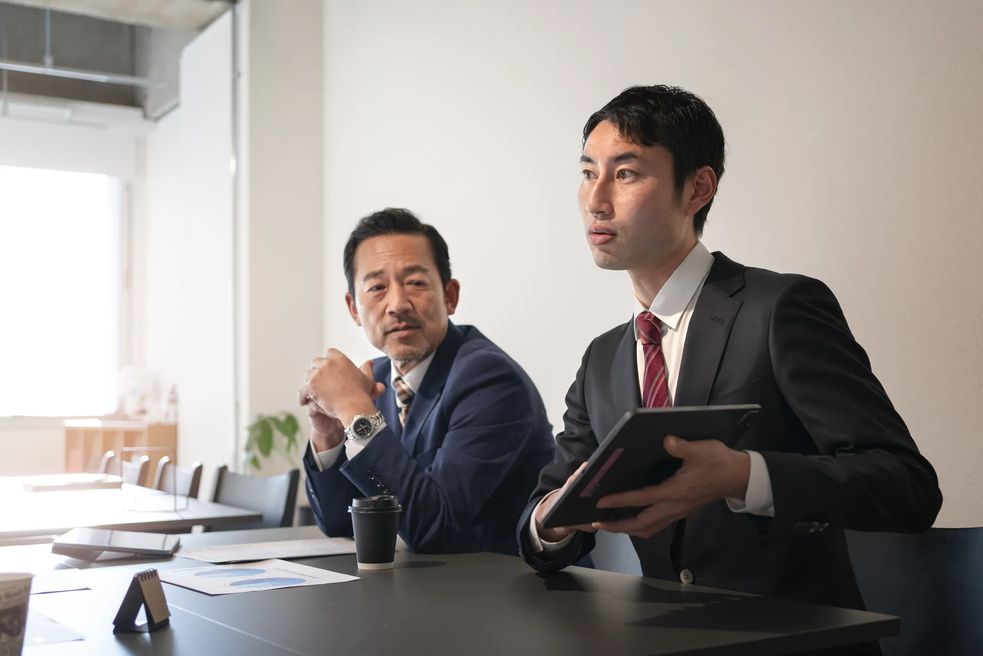 Law firm team collaborating on client case data analysis